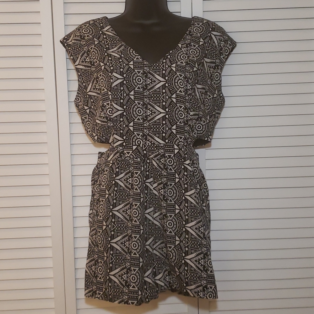 Romper with side cutouts.
